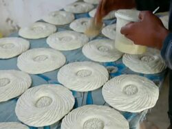 oiling flat bread, traditional way of cooking Stock Footage