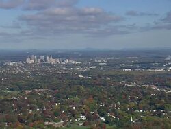 WS AERIAL ZI Wooded area with autumn colors and small town nesting in trees / Connecticut, United States Stock Footage