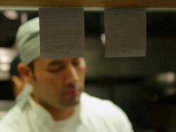 Chef taking food order off counter Stock Footage