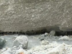 MID of ice formation dripping into small stream on Huayna Potosi glacier in Andes region of Bolivia Stock Footage