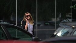 Woman talking on the cell phone Stock Footage