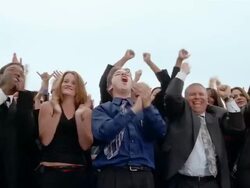 Slow motion low angle medium shot crowd of businesspeople cheering, clapping and jumping up + down Stock Footage
