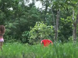 MS little girl picks lime from lime tree in meadow / Cobano, Puntarenas, Costa Rica Stock Footage