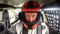 Stock-car driver sits in cockpit, race-car rumbles to life Stock Footage