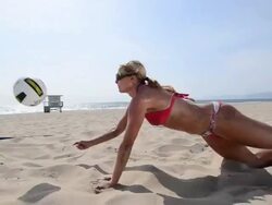 DS WS TS A female beach volleyball player diving for the ball. Stock Footage