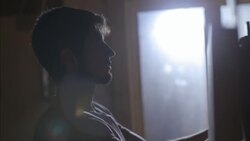 Employee hangs price tag on specialty longboard in skate shop Stock Footage