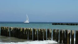 Sailboat - waves crashing against the breakwater Stock Footage