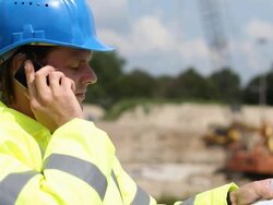 Engineer reviewing Blueprint under Construction Site Stock Footage