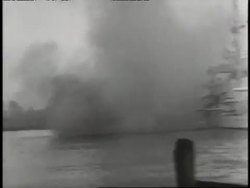 A German battleship fires cannons at the shore during the Invasion of Poland. News Clip