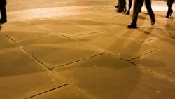 Commuters legs at rushour after dark Stock Footage