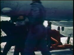 1960s soldiers lowering stairs on belly of airplane + climbing in / Cold War / documentary Stock Footage