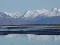 WS Snow covered mountain is reflecting to lagoon / Iceland Stock Footage