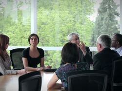 MS coworkers in discussion in conference room/Seattle, Washington, USA Stock Footage