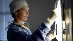 Surgeon reviewing MRI scans Stock Footage