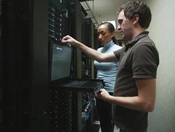 two people in a server room Stock Footage