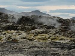 Geothermal area in the Krafla Volcanic Region Iceland, Smoking fields of volcanic lava. Stock Footage