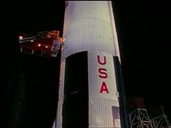 close up tilt up of Apollo 17 rocket at night Stock Footage