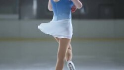 SLO MO TD Female figure skater performing a scratch spin Stock Footage