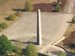 MS AERIAL Shot of Memorial Obelisk at Bergen Belsen / Germany Stock Footage
