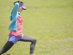 MS Shot of woman makes warm up in jogging wear / Uji, Kyoto, Japan  Stock Footage
