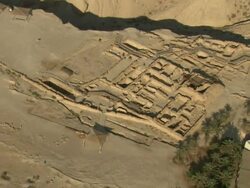 Wide Shot aerial push-in push-out tracking-right zoom-in - A system of grids marks an archaeological dig site in Israel. / Israel Stock Footage