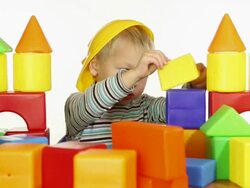 boy builds a house out of blocks Stock Footage