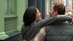 Happy New York couple walk down sidewalk in Soho, girl turns to laugh at camera with arm around boyfriend Stock Footage