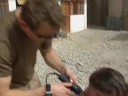 MS ZO ZI Soldier using electric razor / Musa Qala, Helmand Province, Afghanistan. Stock Footage