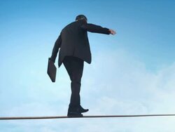 Business man doing balancing act Stock Footage