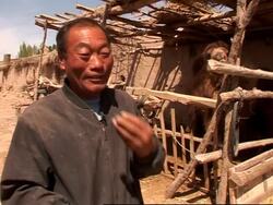 FEATURE 'Changing face of China' AP looks at oasis city slowly becoming part of the desert News Clip