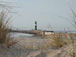 Sailing ship passing a lighthouse Stock Footage