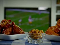 BUFFALO CHICKEN WINGS AND FOOTBALL Stock Footage