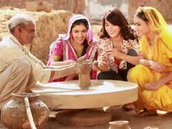 Three young women at pottery wheel in a village, Haryana, India Stock Footage