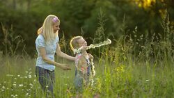 MS Mother And Daughter Bonding Together In Meadow Stock Footage