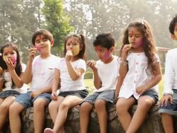 Group of kids eating gujia in holi festivals Stock Footage
