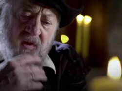 Nostradamus thumbs through a book. Stock Footage