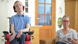 Young cerebral palsy patient watching TV Stock Footage