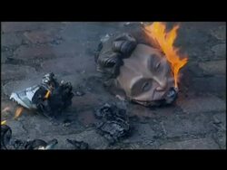 Iraq war protester burns Tony Blair mask outside Iraq Inquiry building News Clip