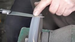 HD: Knife Sharpening On Grinder Stock Footage