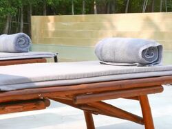Towel on bed pool Stock Footage