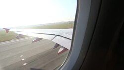 View over airplane wing during take off Stock Footage