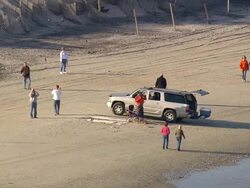   WS AERIAL ZI View of people playing football on beach / North Carolina, United States Stock Footage