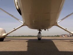 Aircraft taxiing to runway, beautifull low angle shot Stock Footage