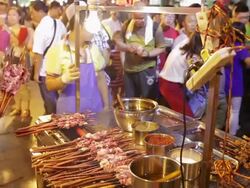 MS Man grilling shashlik at the market /Xi'an, Shaanxi, China Stock Footage