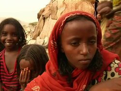 Children looking at camera and small child starting to cry Stock Footage