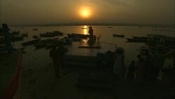 Diwali celebrants gather on a river during sunrise. Stock Footage