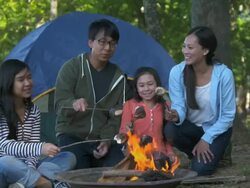 WS ZI Family on Camping Vacation, Roasting Marshmallows Over Camp Fire / Richmond, Virginia, United States Stock Footage