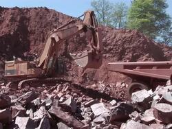 MS Digger and truck working in quarry  / Taben-Rodt, North Rhine- Westphalia, Germany Stock Footage