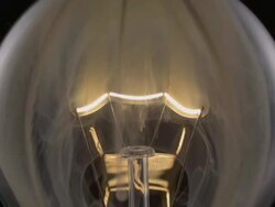 ECU SLO MO Shot of light bulb, showing burning and smoking tungsten wire / Munich, Bavaria, Germany Stock Footage