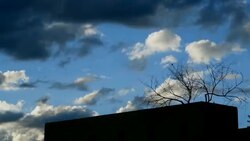 Time Lapse Santa Fe New Mexico abobe building with tree and stormy monsoon clouds Stock Footage